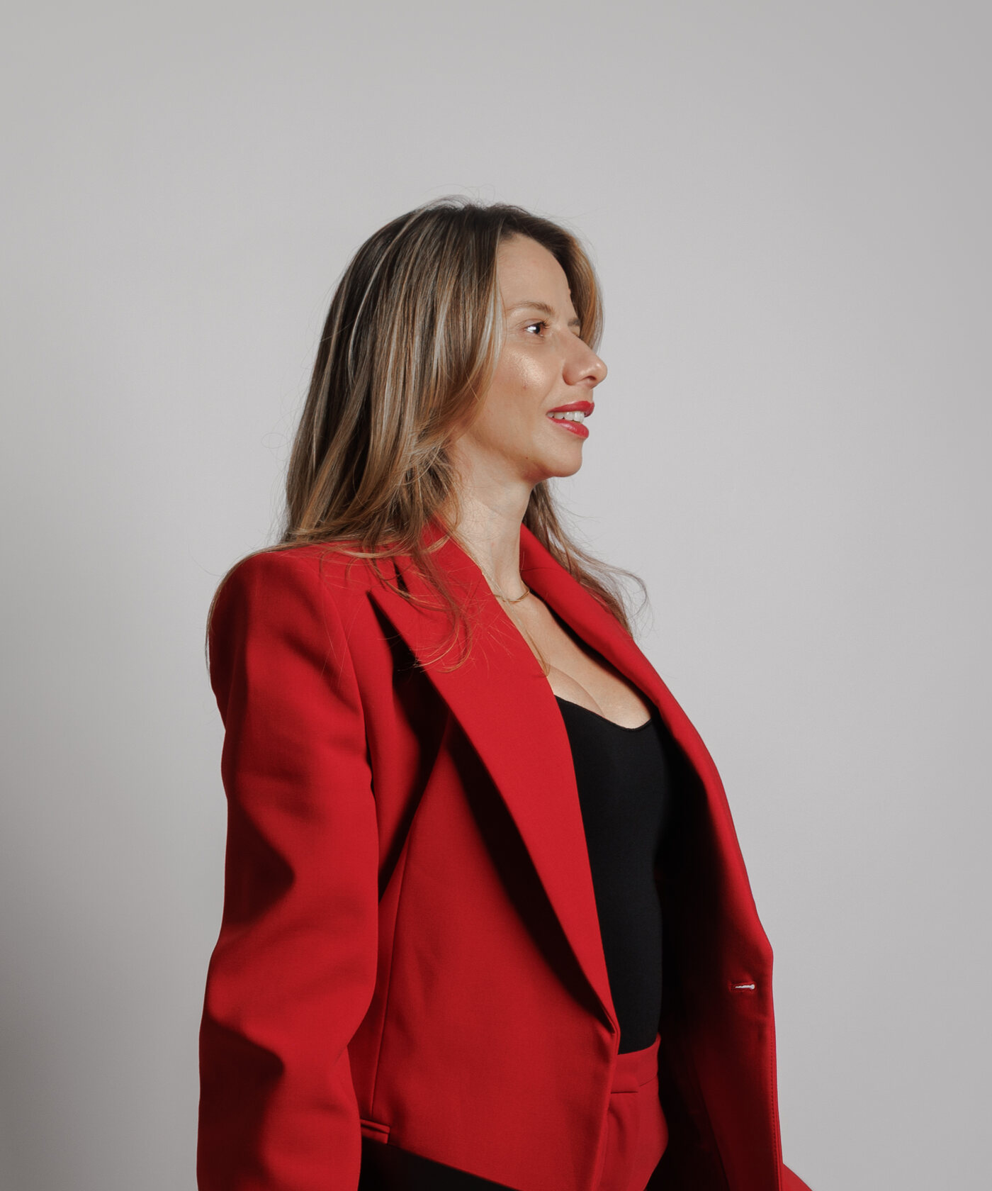 Monika in a red blazer